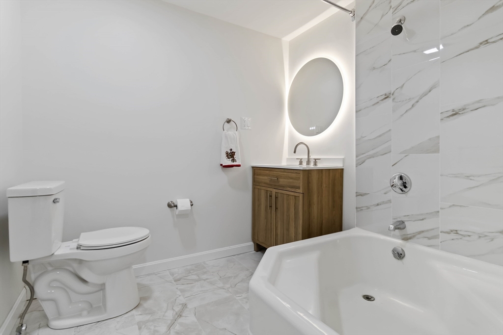 58 Cutler Drive Framingham, MA 01702 - Photo 19 of 36 a bathroom with a sink and a toilet