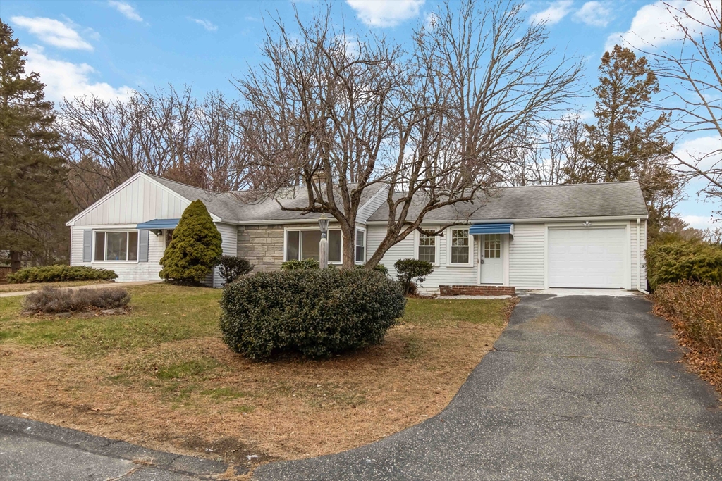 58 Cutler Drive Framingham, MA 01702 - Photo 2 of 36 a front view of a house with a yard