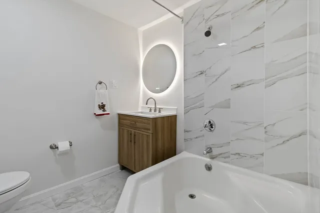 a bathroom with a sink a toilet and a bathtub