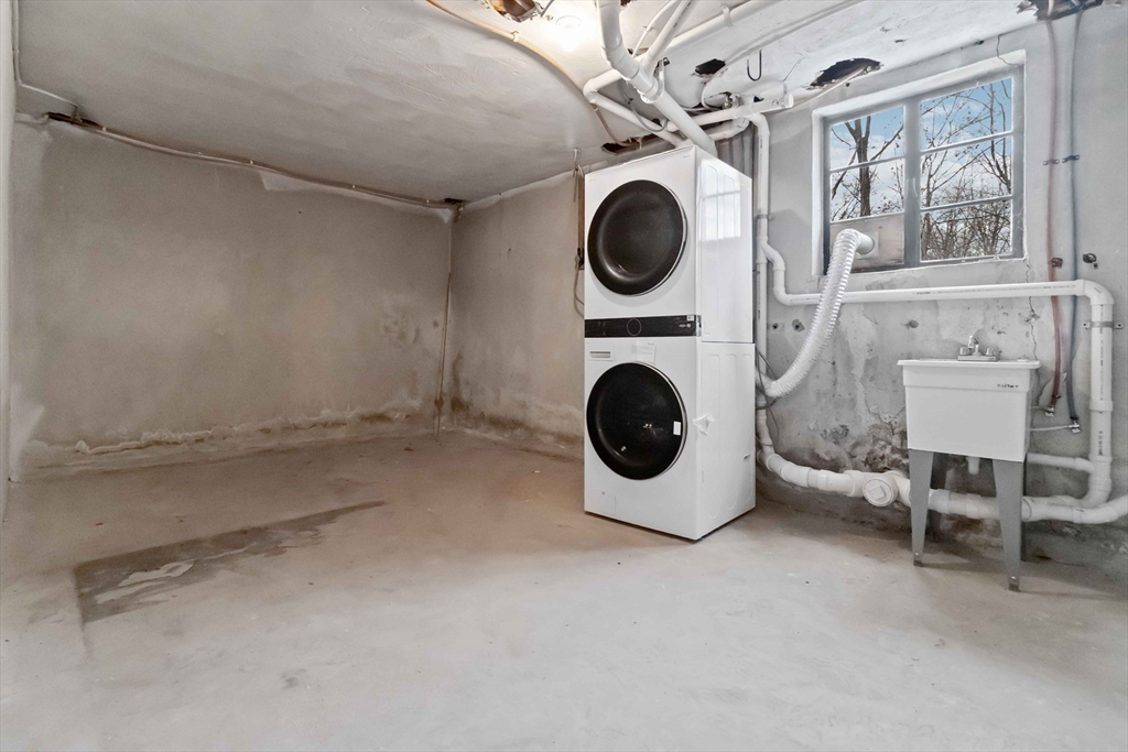 58 Cutler Drive Framingham, MA 01702 - Photo 31 of 36 a view of livingroom with washer and dryer