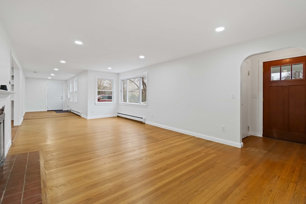 58 Cutler Drive Framingham, MA 01702 - Photo 5 of 36 a view of empty room with wooden floor