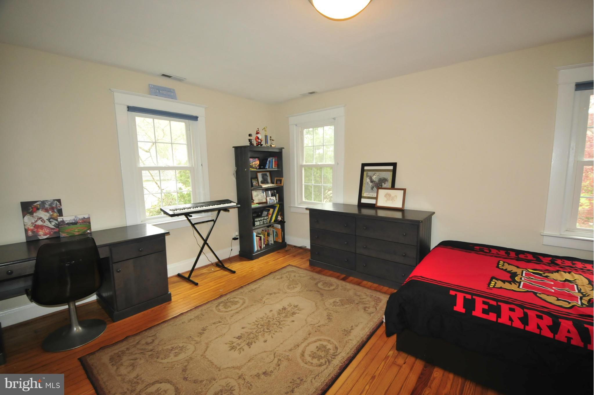 1825 Fairbank Road Baltimore, MD 21209 - Photo 21 of 27 a bedroom with a bed and furniture
