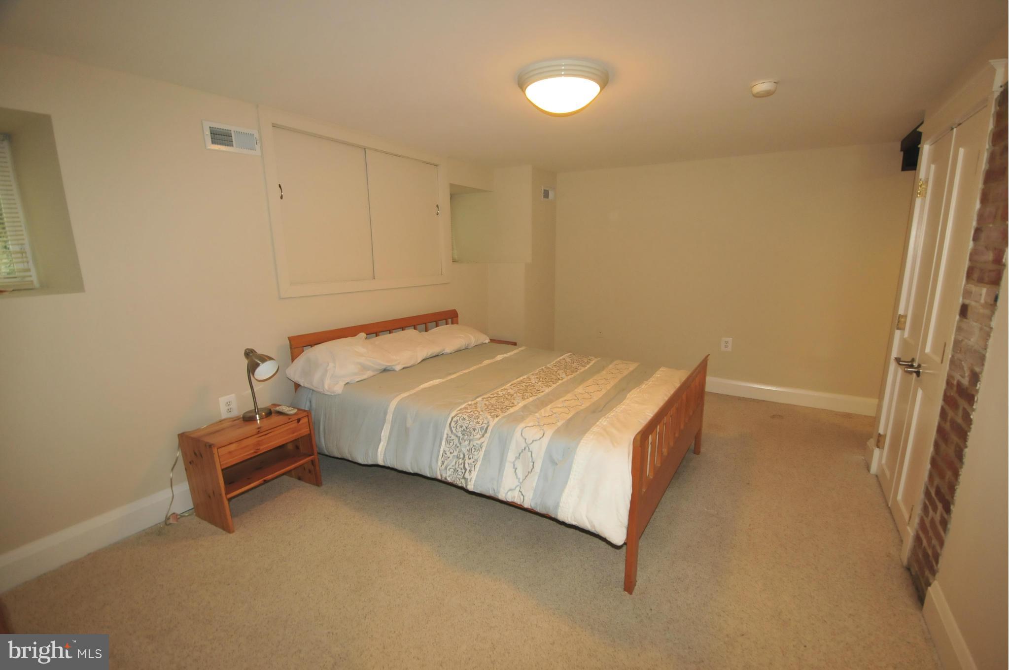 1825 Fairbank Road Baltimore, MD 21209 - Photo 23 of 27 a bedroom with a bed and a window