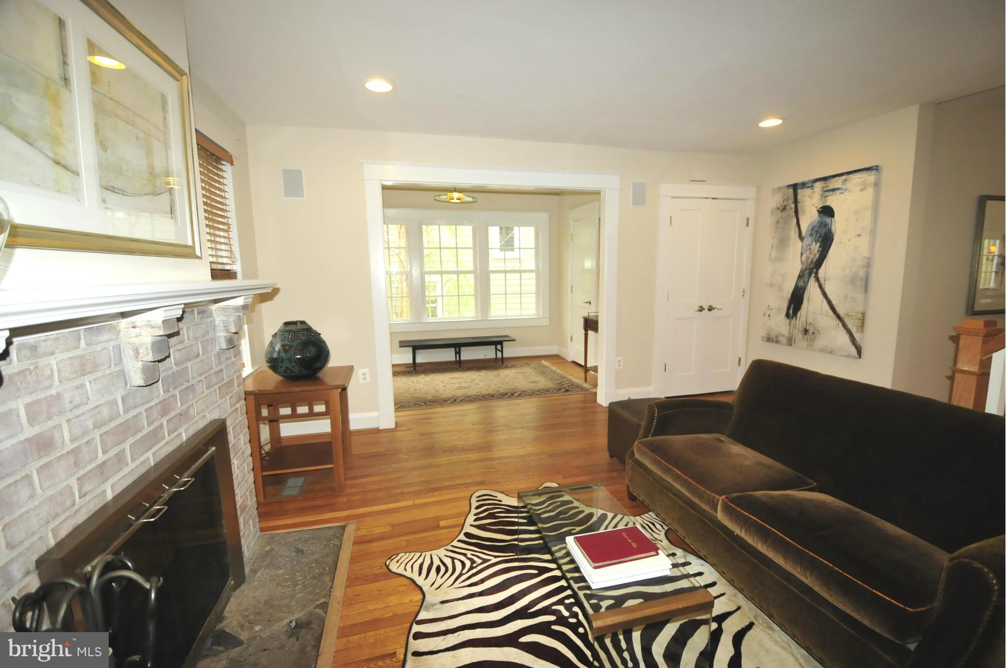 1825 Fairbank Road Baltimore, MD 21209 - Photo 5 of 27 a living room with furniture and a fireplace
