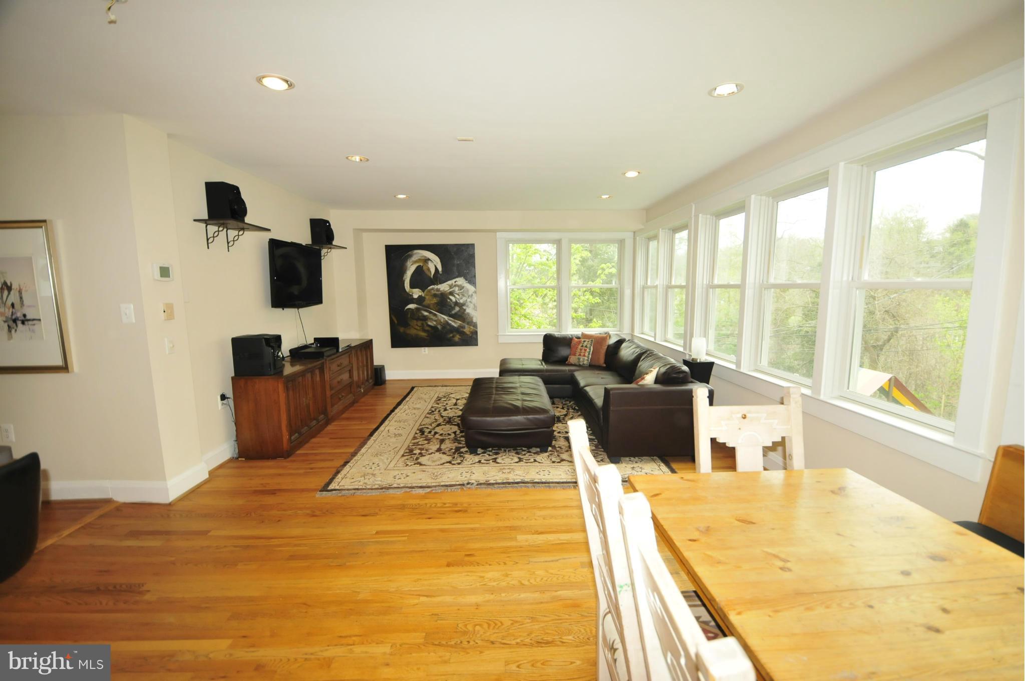 1825 Fairbank Road Baltimore, MD 21209 - Photo 6 of 27 a bedroom with a large bed and a large window
