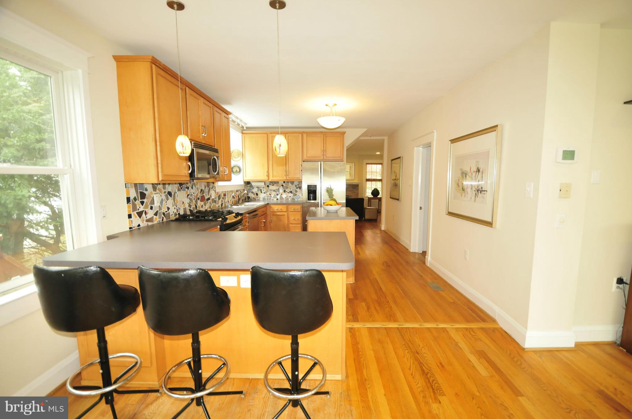 1825 Fairbank Road Baltimore, MD 21209 - Photo 8 of 27 a dining room with furniture and a large window