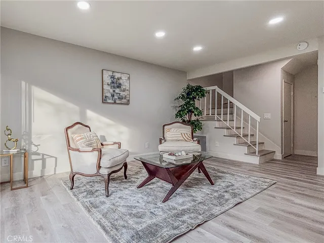a living room with furniture and a rug