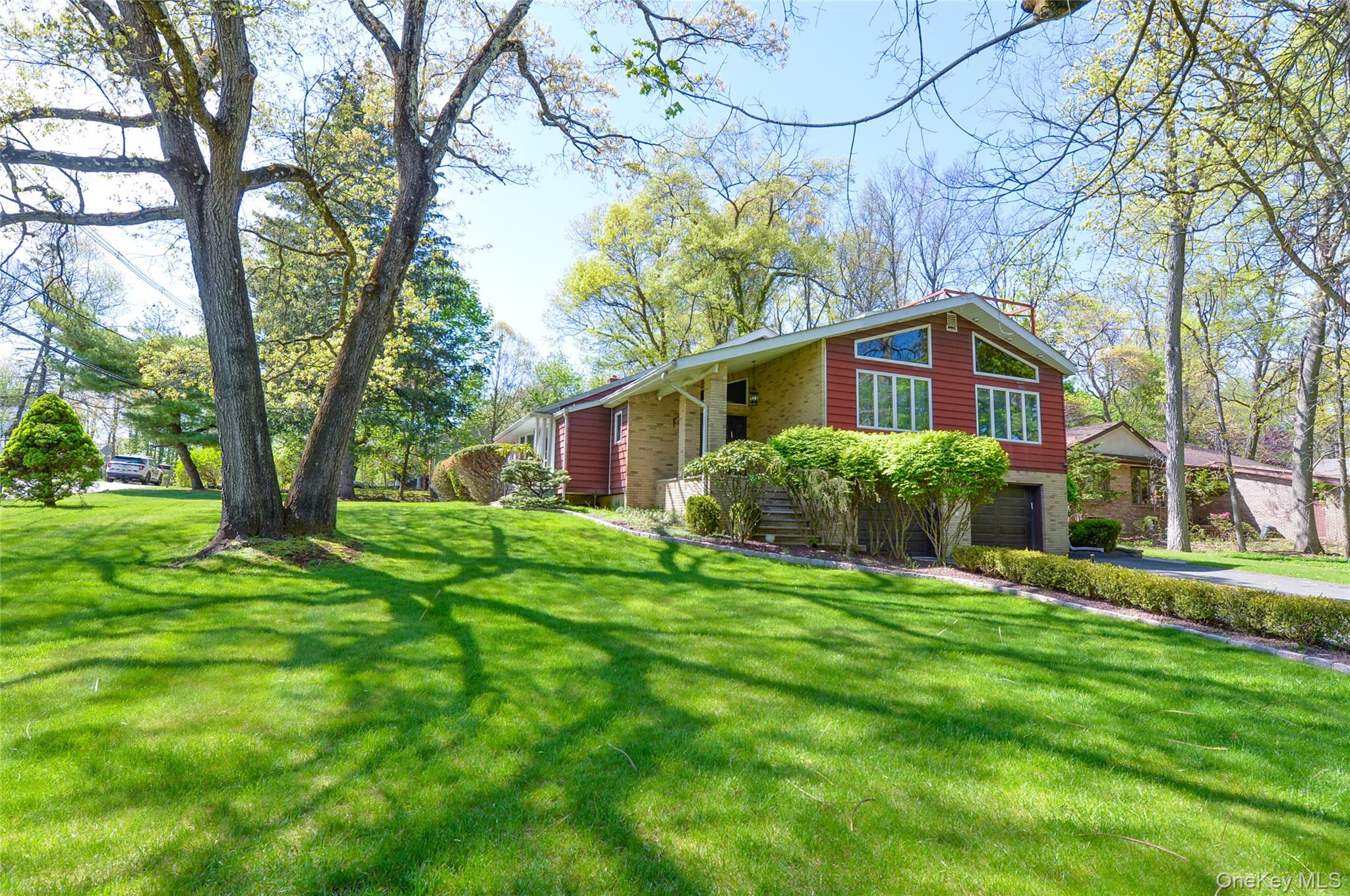 24 Highview Road Monsey, NY 10952 - Photo 2 of 44 a front view of a house with yard and green space