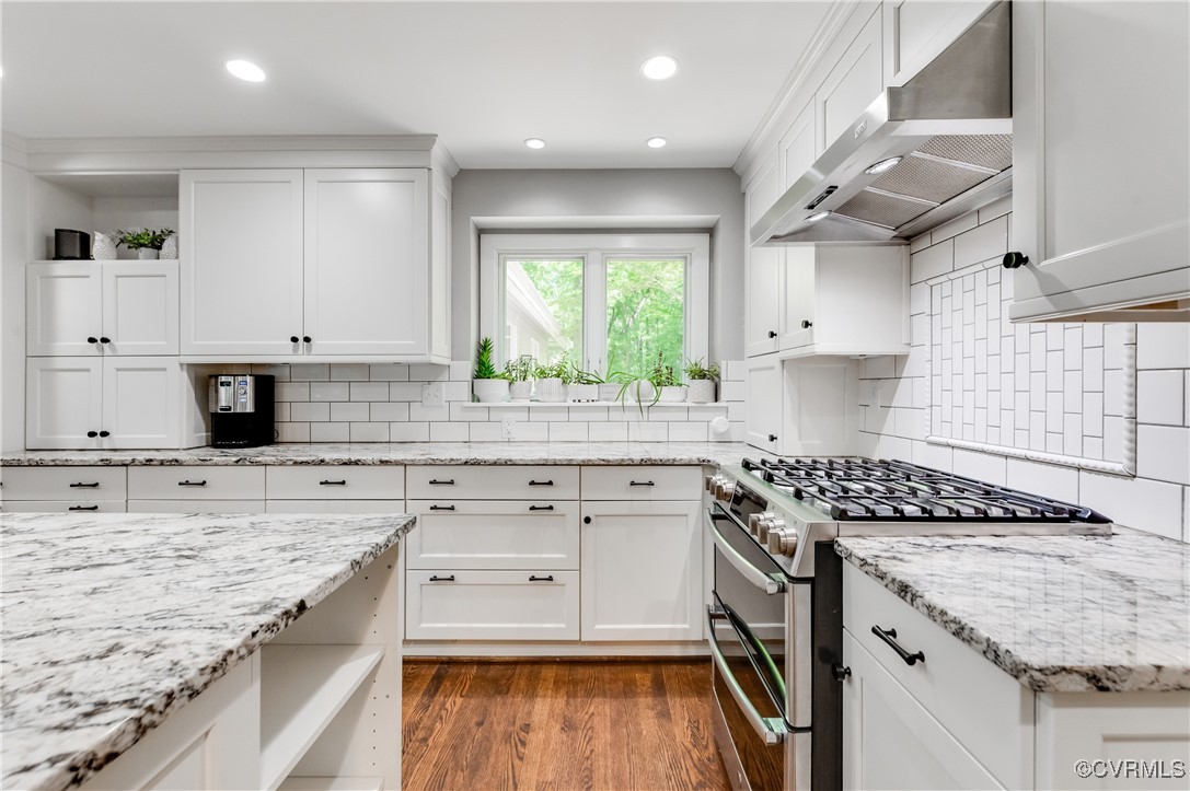 3510 Lansdowne Road Midlothian, VA 23113 - Photo 18 of 47 a kitchen with stainless steel appliances granite countertop a stove sink and cabinets