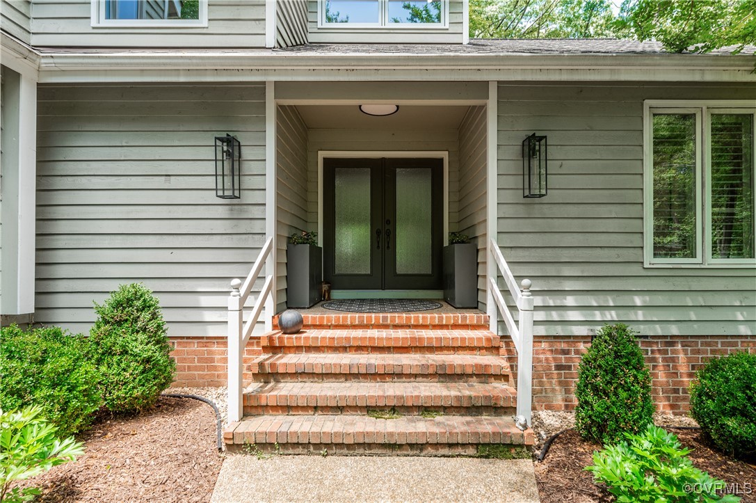 3510 Lansdowne Road Midlothian, VA 23113 - Photo 2 of 47 a front view of a house with a porch