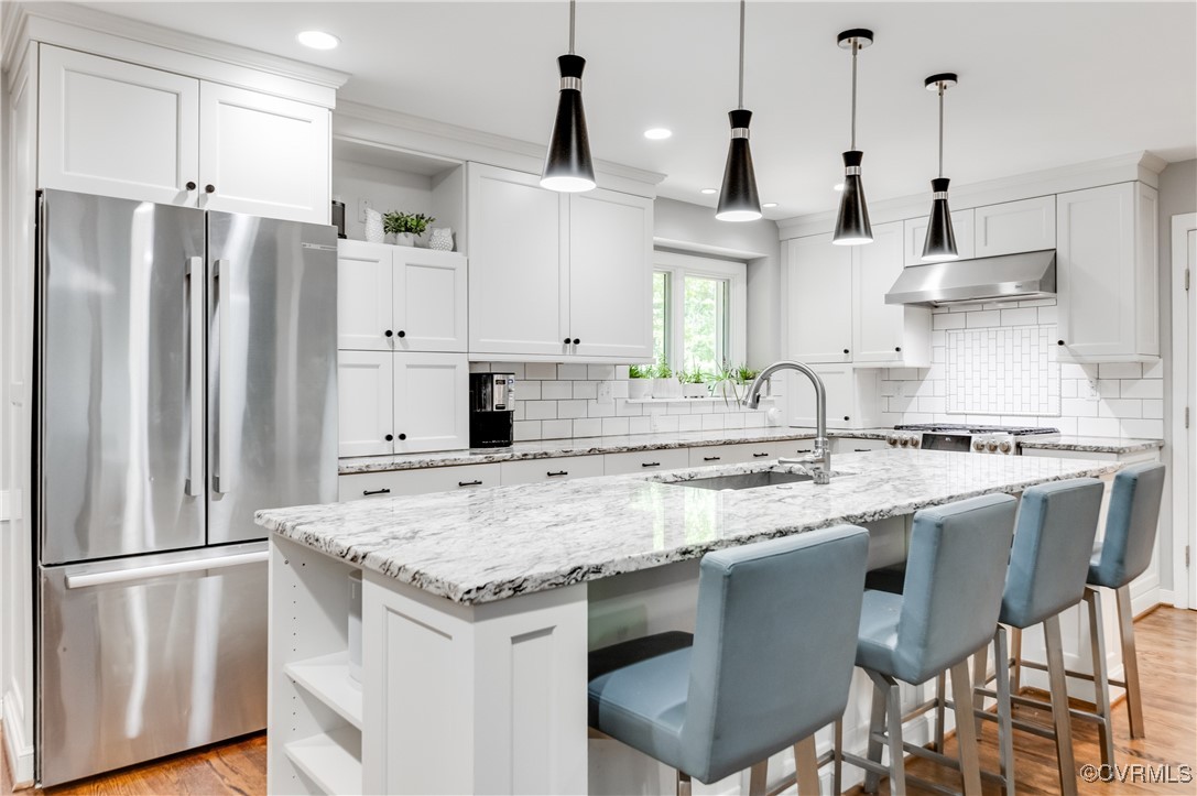 3510 Lansdowne Road Midlothian, VA 23113 - Photo 21 of 47 a kitchen with stainless steel appliances granite countertop a sink stove and refrigerator