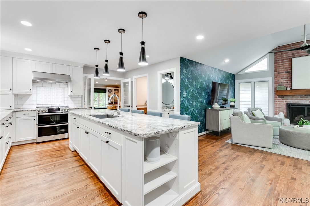 3510 Lansdowne Road Midlothian, VA 23113 - Photo 22 of 47 a large kitchen with stainless steel appliances kitchen island granite countertop a stove and a sink