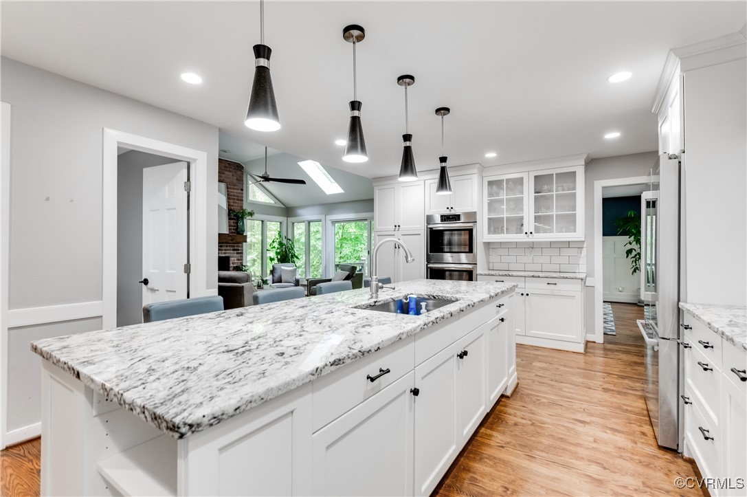 3510 Lansdowne Road Midlothian, VA 23113 - Photo 24 of 47 a large kitchen with kitchen island a large island in the center a sink stainless steel appliances and cabinets