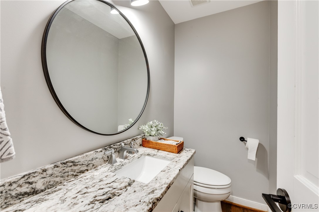3510 Lansdowne Road Midlothian, VA 23113 - Photo 33 of 47 a bathroom with a granite countertop sink mirror vanity and toilet
