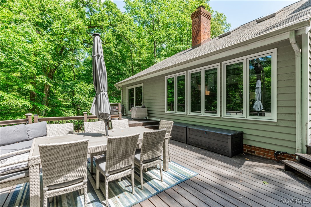 3510 Lansdowne Road Midlothian, VA 23113 - Photo 44 of 47 a view of a patio with a dining table and chairs with wooden floor