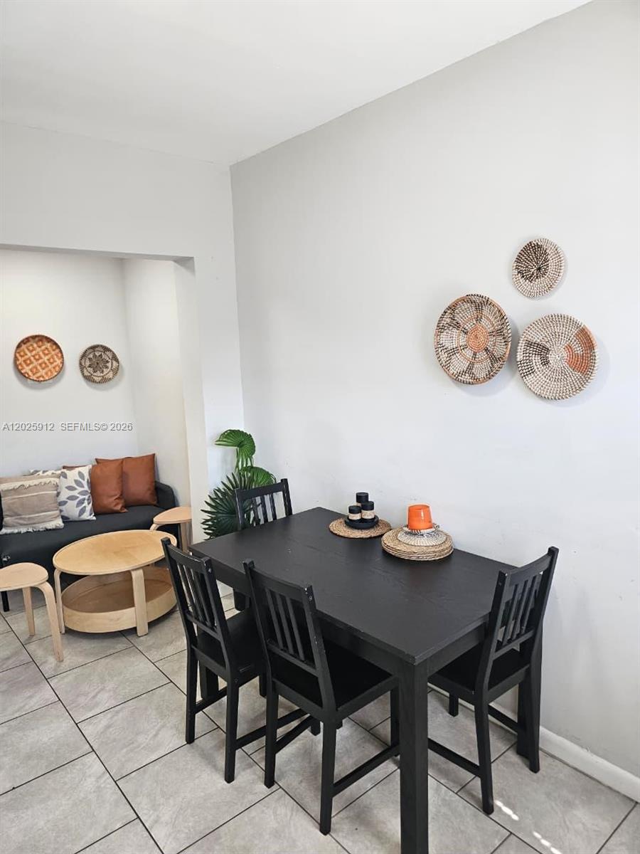 2224 Southwest 11th Street, Unit 3 Miami, FL 33135 - Photo 6 of 15 a dining room with furniture and wooden floor