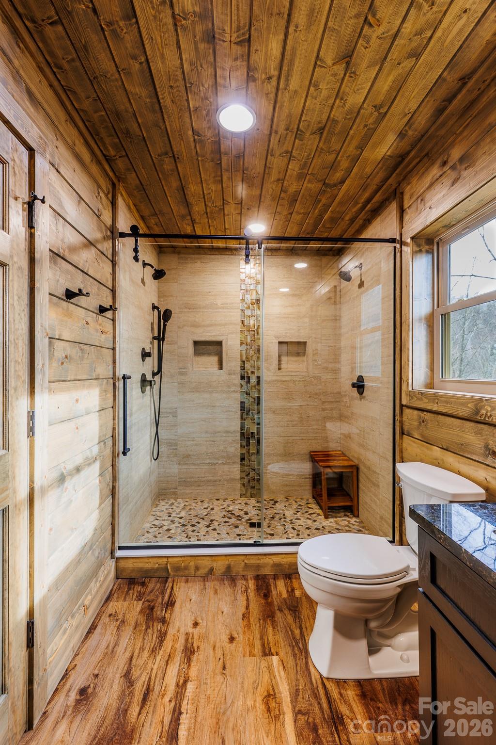 601 Tater Patch Road Maggie Valley, NC 28751 - Photo 20 of 32 a bathroom with a toilet and shower