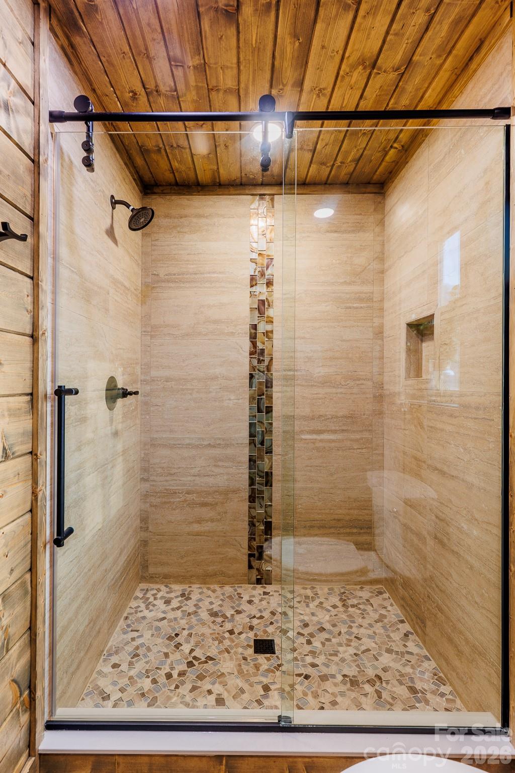 601 Tater Patch Road Maggie Valley, NC 28751 - Photo 23 of 32 a bathroom with a shower