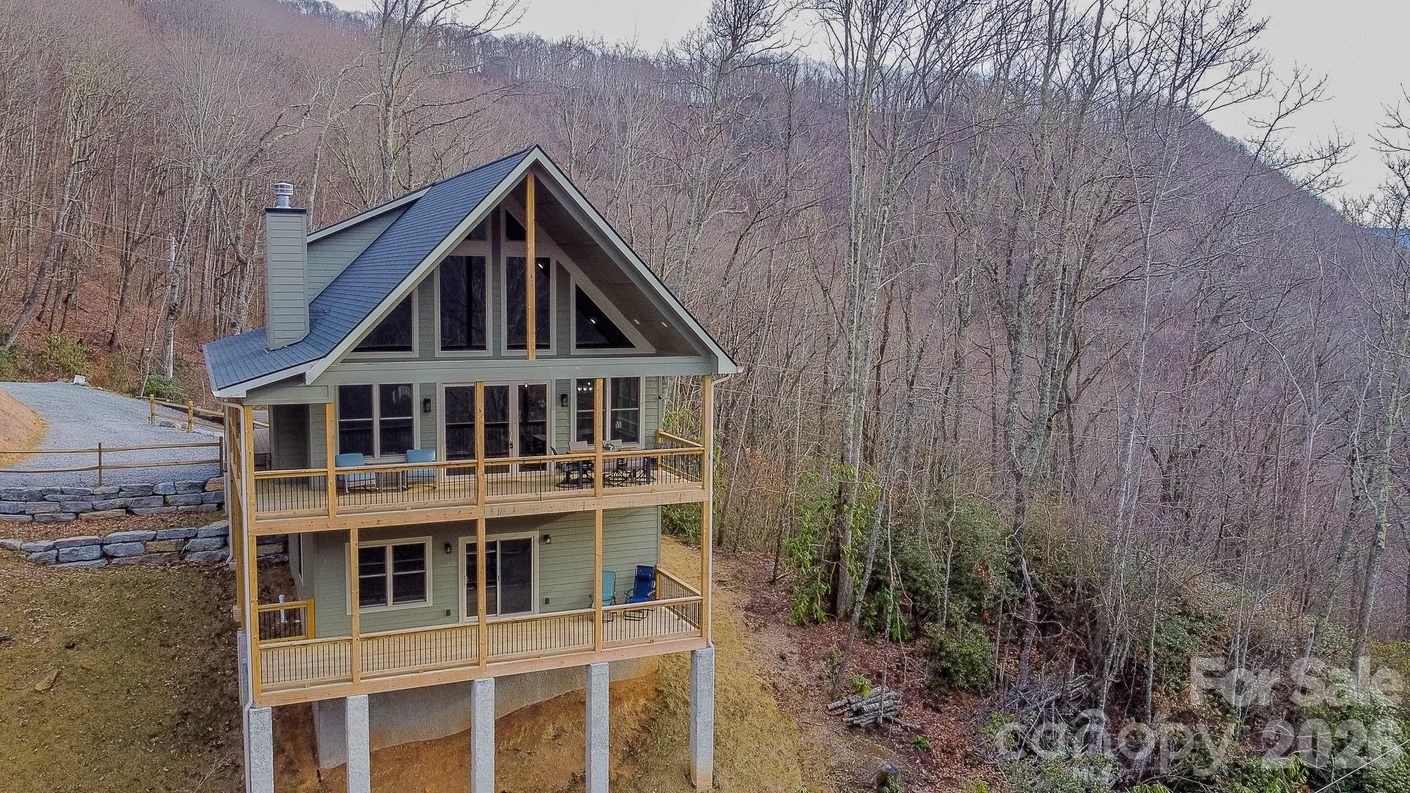 601 Tater Patch Road Maggie Valley, NC 28751 - Photo 4 of 32 a front view of a house with a yard
