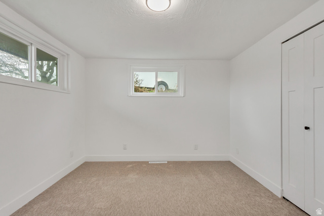 337 West 2900th Street South Bountiful, UT 84010 - Photo 18 of 35 Unfurnished bedroom with light colored carpet and a closet
