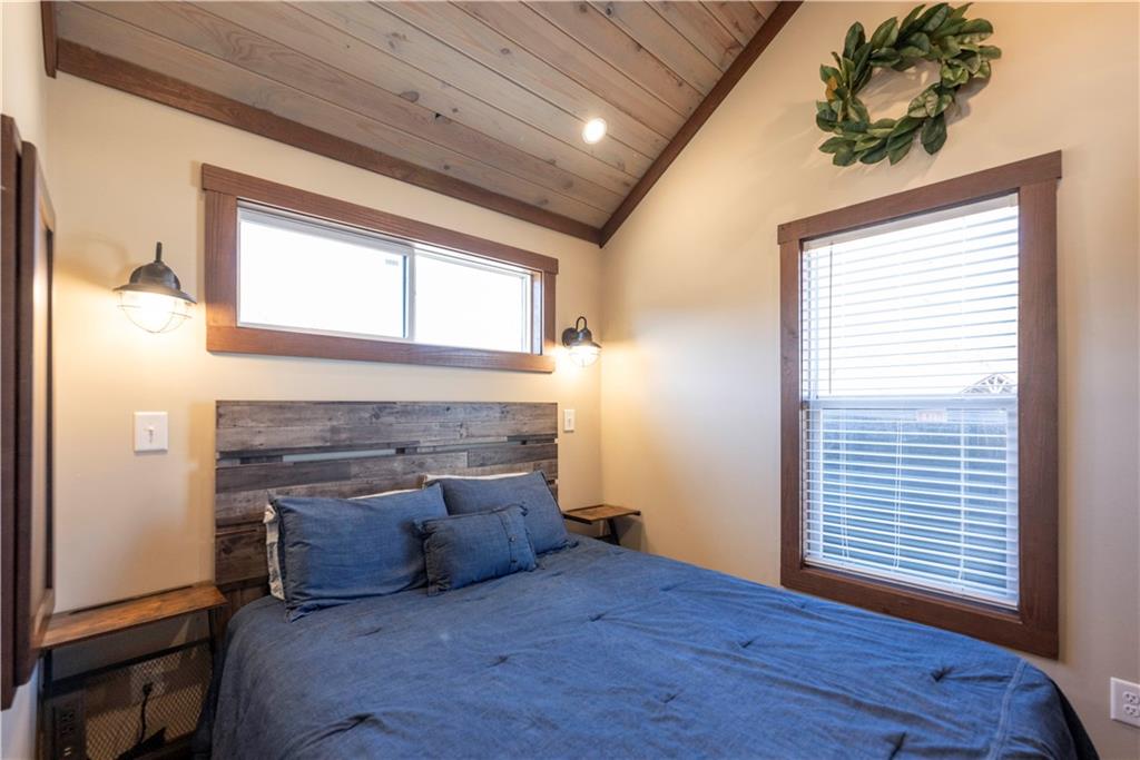 192 Mountain Road Morganton, GA 30560 - Photo 14 of 42 a large bedroom with a bed and a fireplace