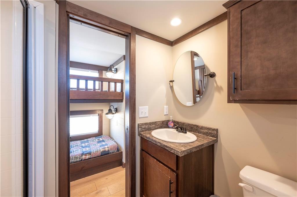 192 Mountain Road Morganton, GA 30560 - Photo 18 of 42 a bathroom with a sink vanity and a mirror