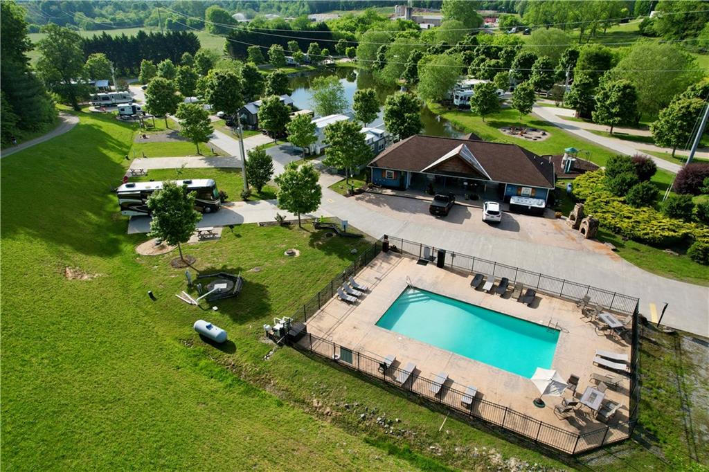 192 Mountain Road Morganton, GA 30560 - Photo 32 of 42 an aerial view of a house with a garden and swimming pool