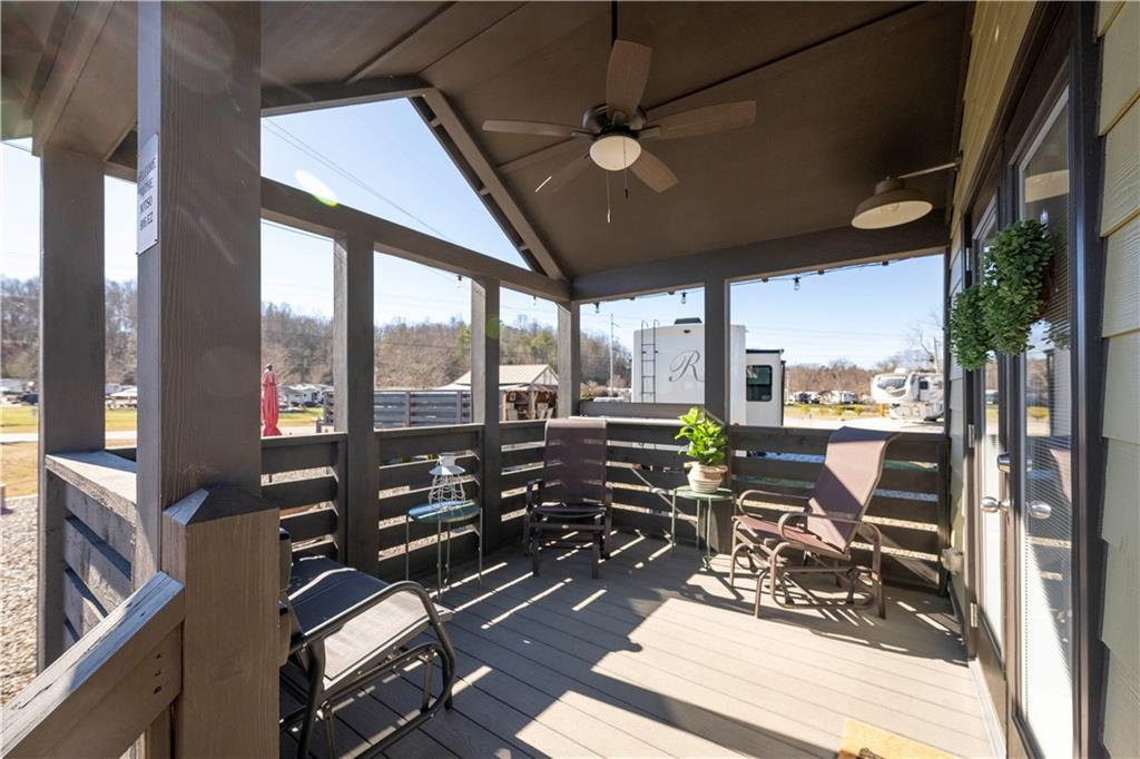 192 Mountain Road Morganton, GA 30560 - Photo 4 of 42 a view of a balcony with couch and wooden floor