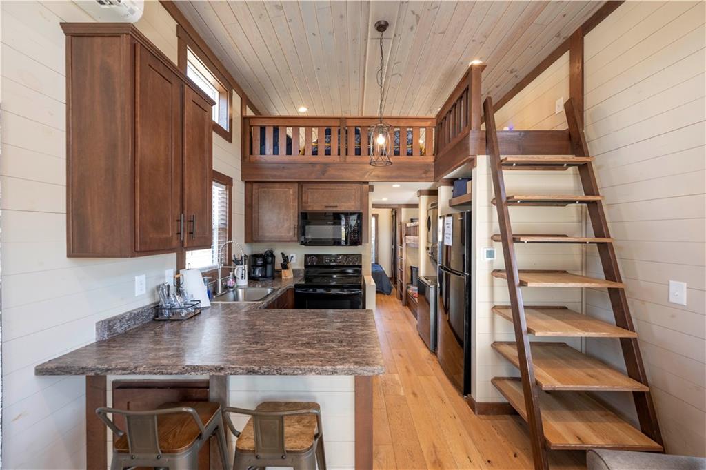 192 Mountain Road Morganton, GA 30560 - Photo 9 of 42 a kitchen with a refrigerator and a sink