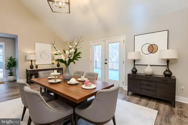 a view of empty room with wooden floor and fireplace