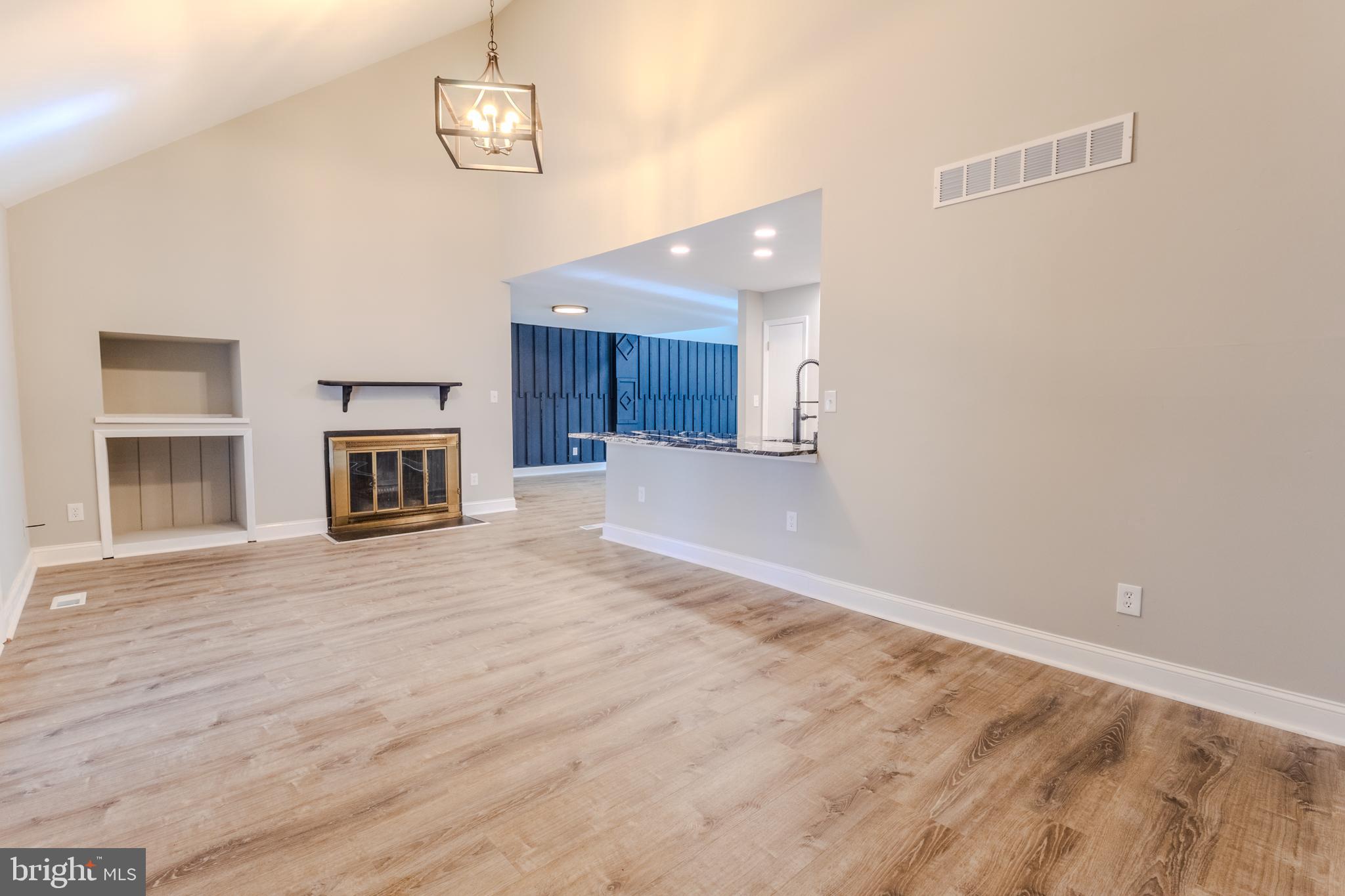 524 Ridge Road Annapolis, MD 21401 - Photo 16 of 53 a view of empty room with wooden floor and fireplace
