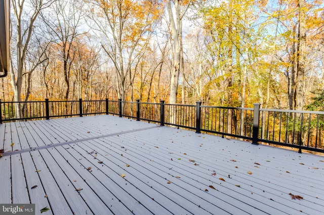 a backyard of a house with wooden floor