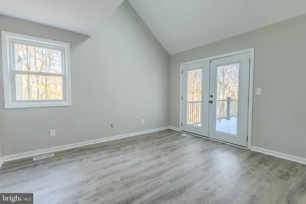 a bed room with a bed and a dresser