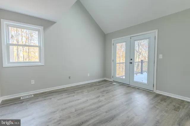 a bed room with a bed and a dresser