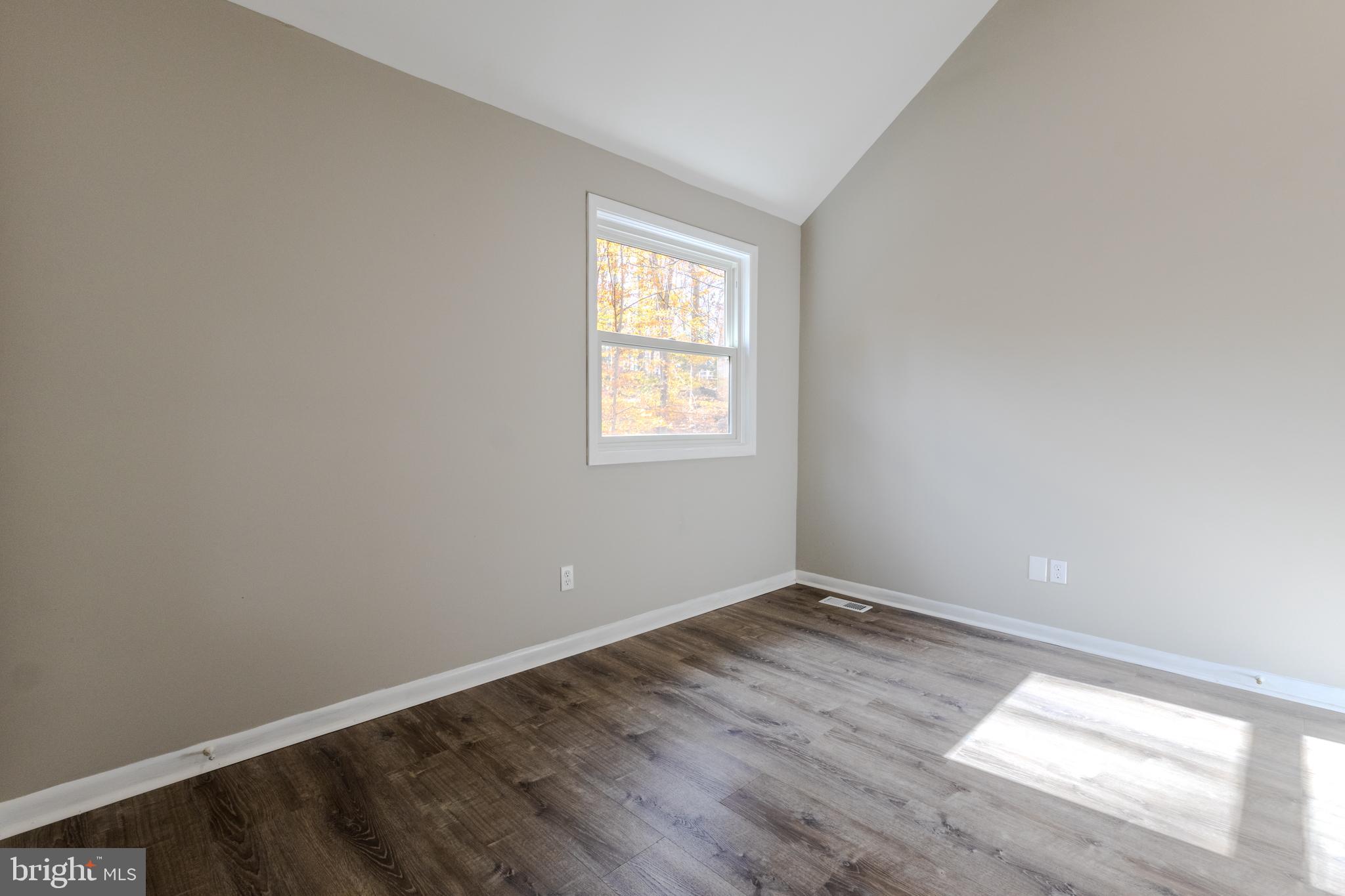 524 Ridge Road Annapolis, MD 21401 - Photo 24 of 53 an empty room with wooden floor and windows