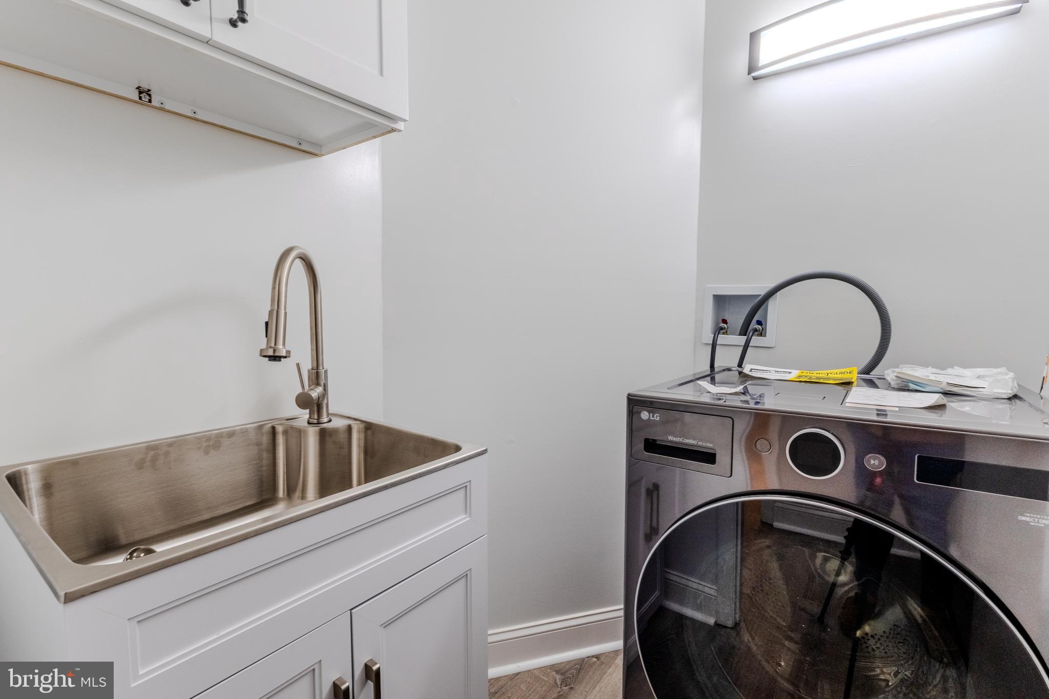 524 Ridge Road Annapolis, MD 21401 - Photo 27 of 53 a close view of a sink and a washer and dryer