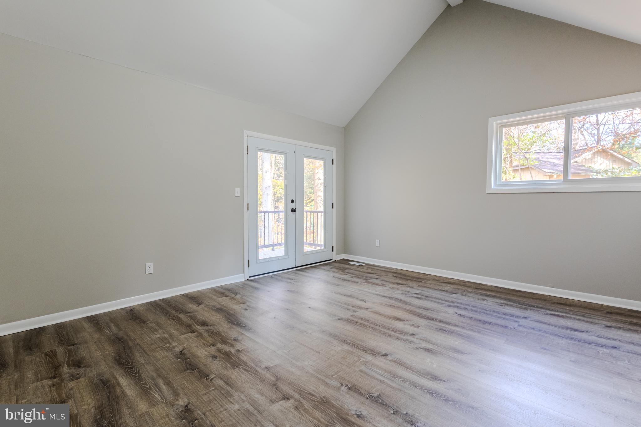 524 Ridge Road Annapolis, MD 21401 - Photo 29 of 53 a view of an empty room with wooden floor and a window