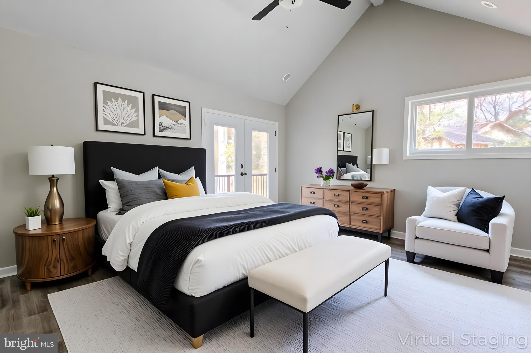 524 Ridge Road Annapolis, MD 21401 - Photo 30 of 53 a spacious bedroom with a bed a couch and windows