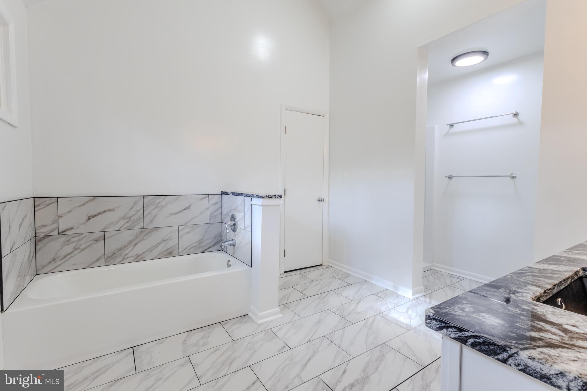 524 Ridge Road Annapolis, MD 21401 - Photo 34 of 53 a bathroom with a bathtub and shower