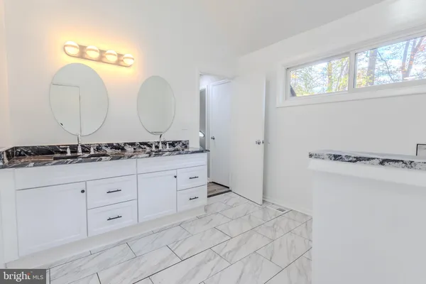 a bathroom with a toilet and a sink