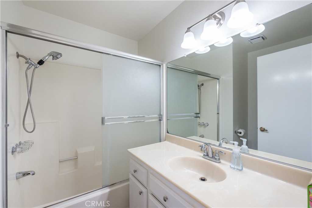 49 Summerstone Irvine, CA 92614 - Photo 17 of 28 a bathroom with a sink vanity mirror and shower