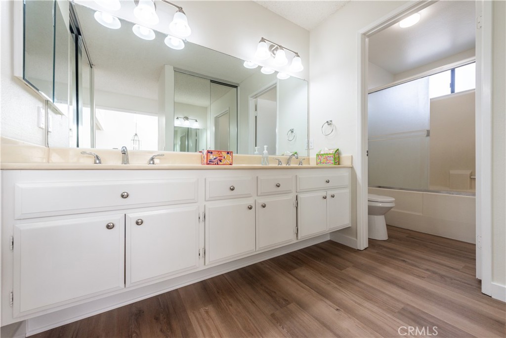 49 Summerstone Irvine, CA 92614 - Photo 21 of 28 a bathroom with a double vanity sink toilet and shower