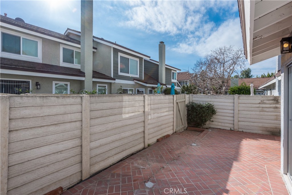49 Summerstone Irvine, CA 92614 - Photo 23 of 28 a view of a house with wooden fence