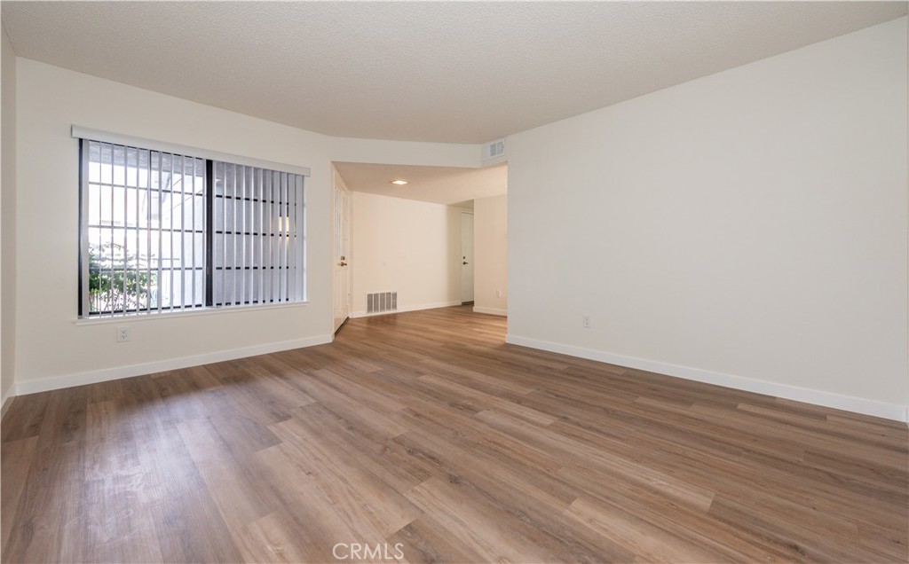 49 Summerstone Irvine, CA 92614 - Photo 6 of 28 wooden floor in an empty room with a window