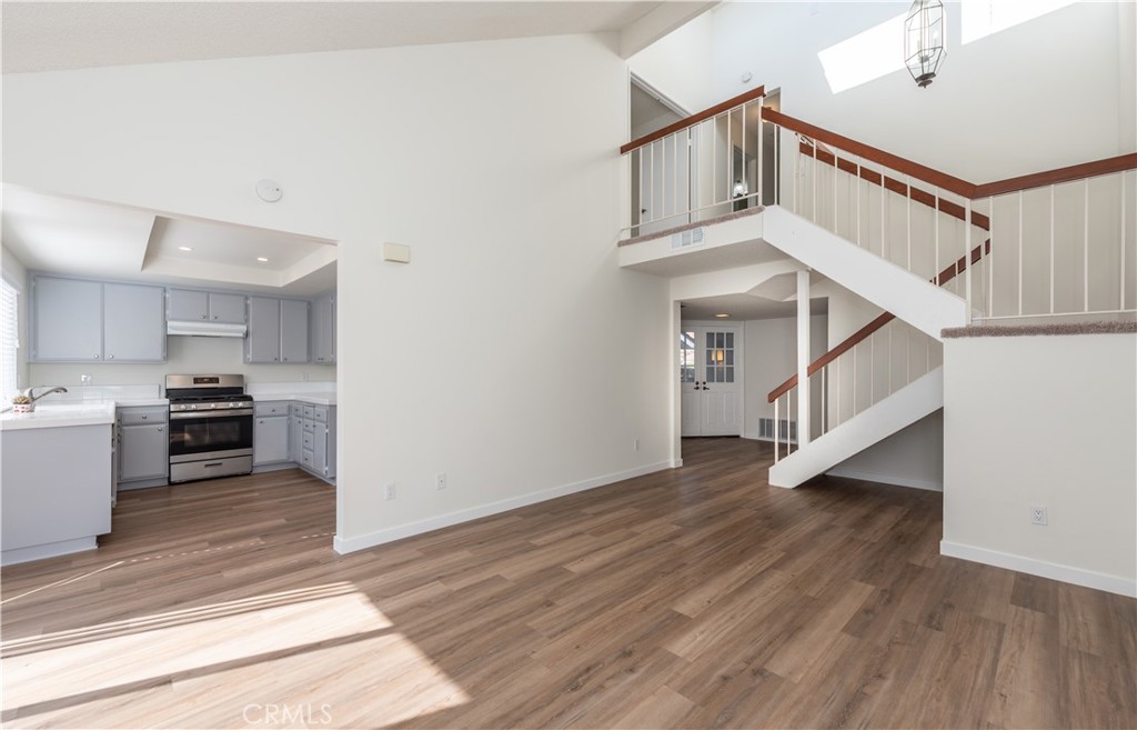 49 Summerstone Irvine, CA 92614 - Photo 8 of 28 a view of a kitchen with wooden floor and electronic appliances