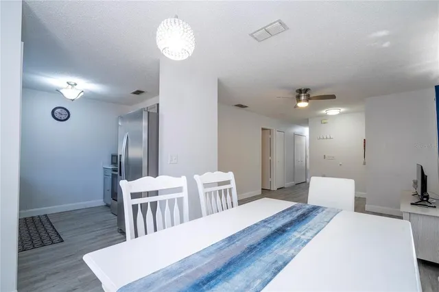 a bathroom with double vanity sinks and a mirror