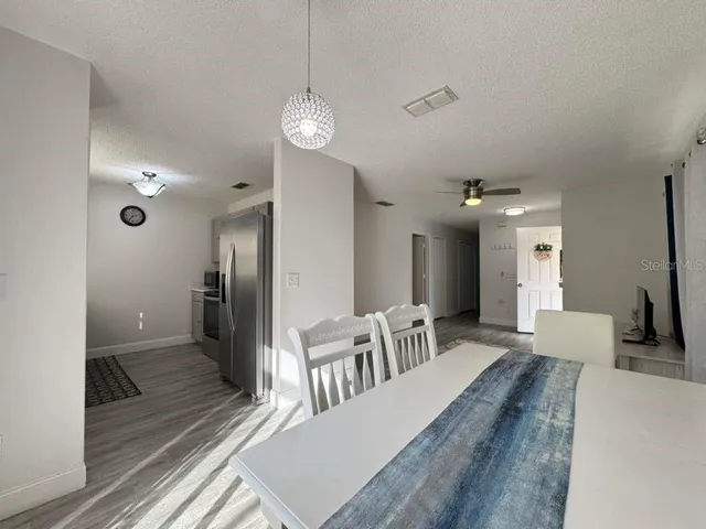 a kitchen with a sink stainless steel appliances and cabinets