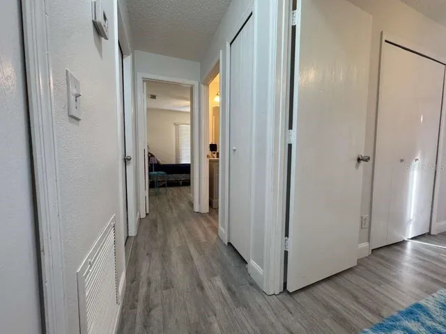 a living room with a bed furniture and a window