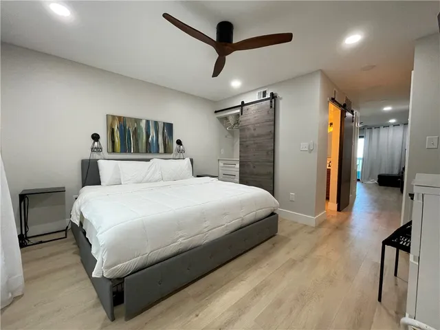 a room with a chair and a flat screen tv