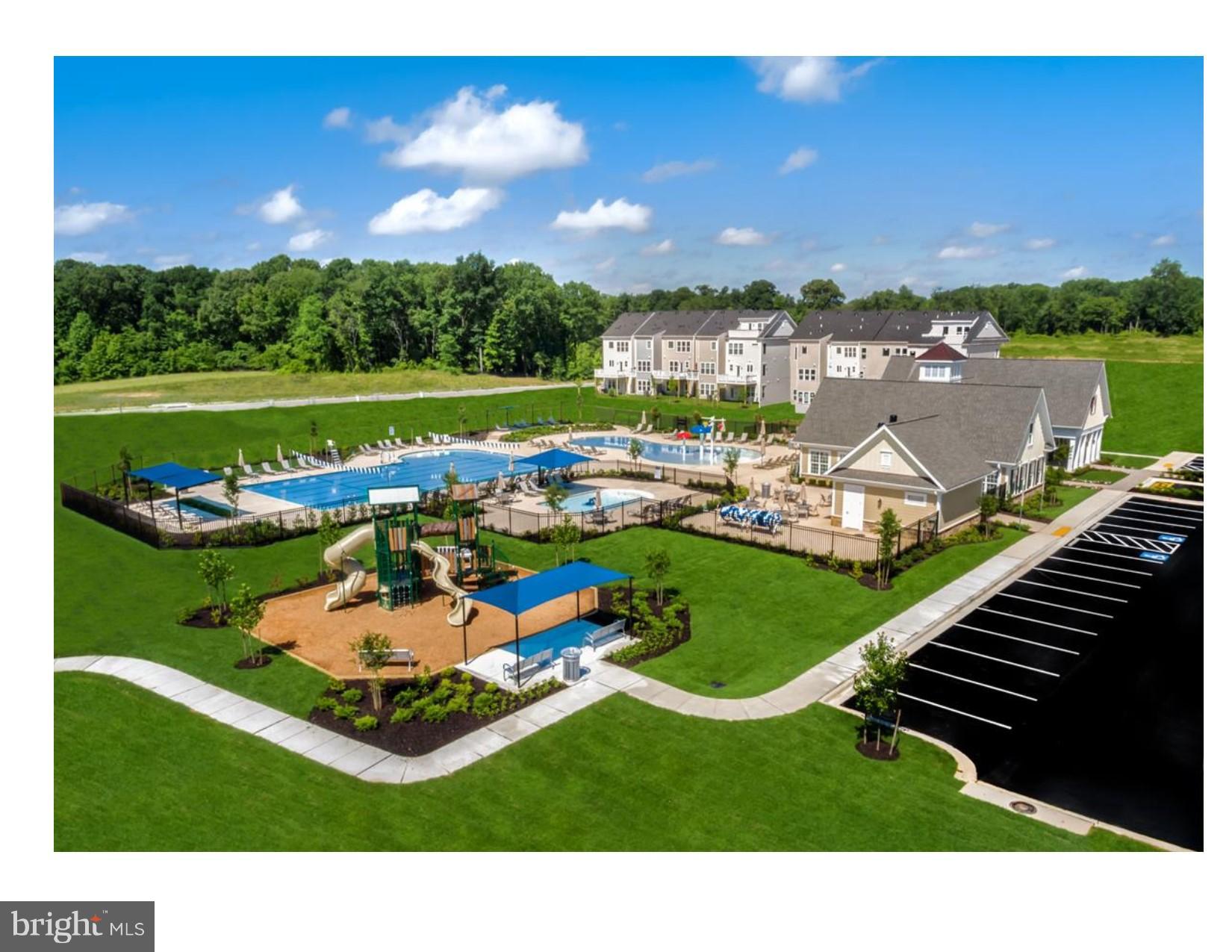 7641 Deepnotch Way Hanover, MD 21076 - Photo 23 of 25 a aerial view of a house with a garden and lake view